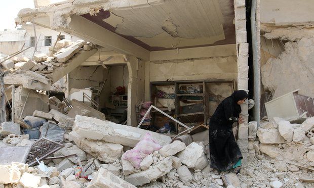 A woman inspects the damage after an airstrike in the Bab al-Nairab neighborhood of Aleppo, Syria, August 2016. Photograph: Abdalrhman Ismail/Reuters