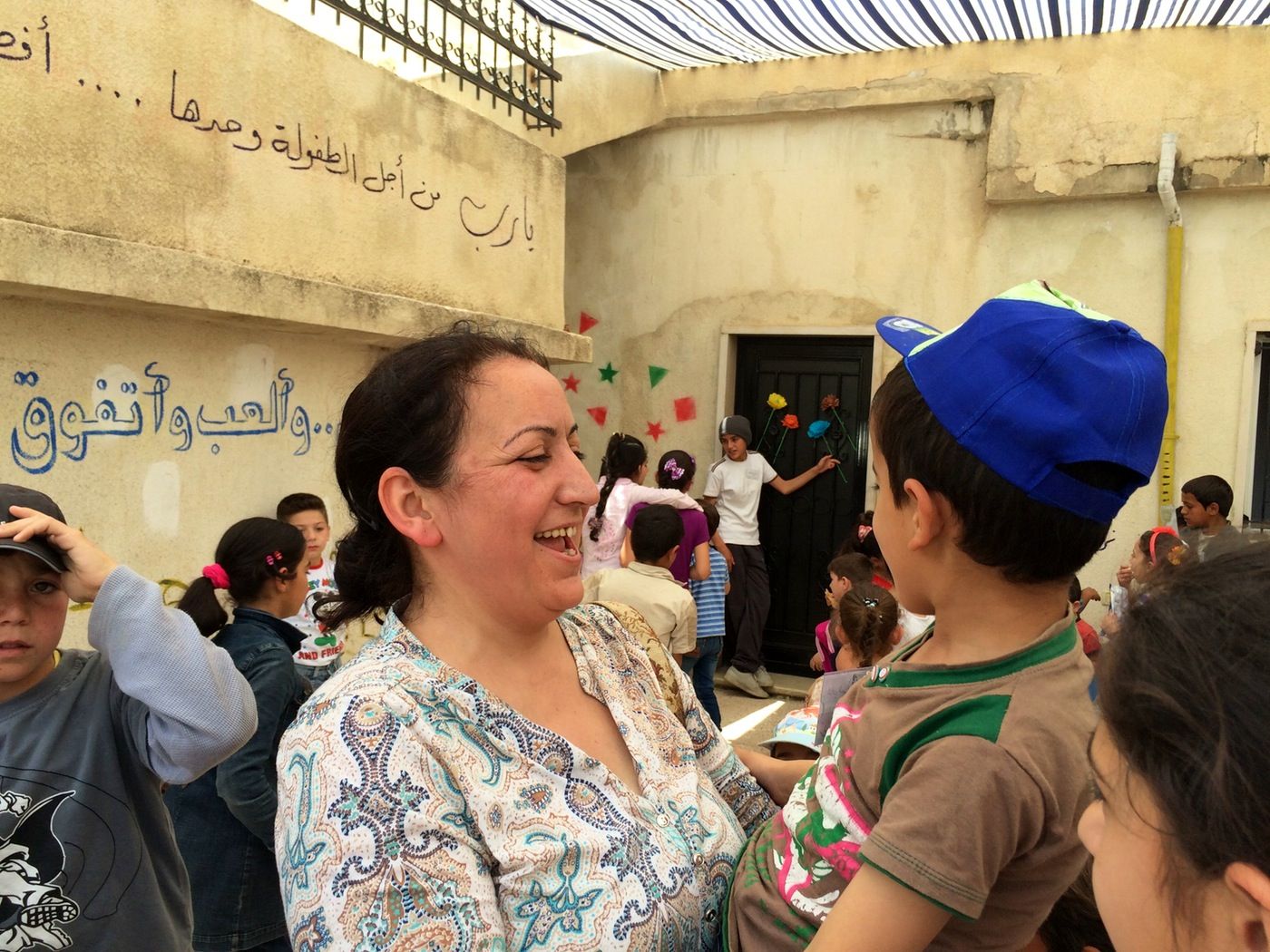 Ola Al-Junde, 43, is a Syrian math teacher who juggles her day job managing one school for Syrian refugee kids with volunteering at others. (Annia Ciezadlo)