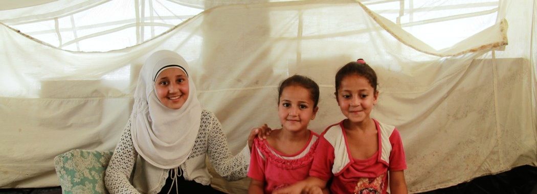 Umm Abdu’s daughters, Siham, Hala and Nur in the Old Garage camp in Syrian government-controlled Tartus. (Ghenwa Yusuf/Good Morning Syria)